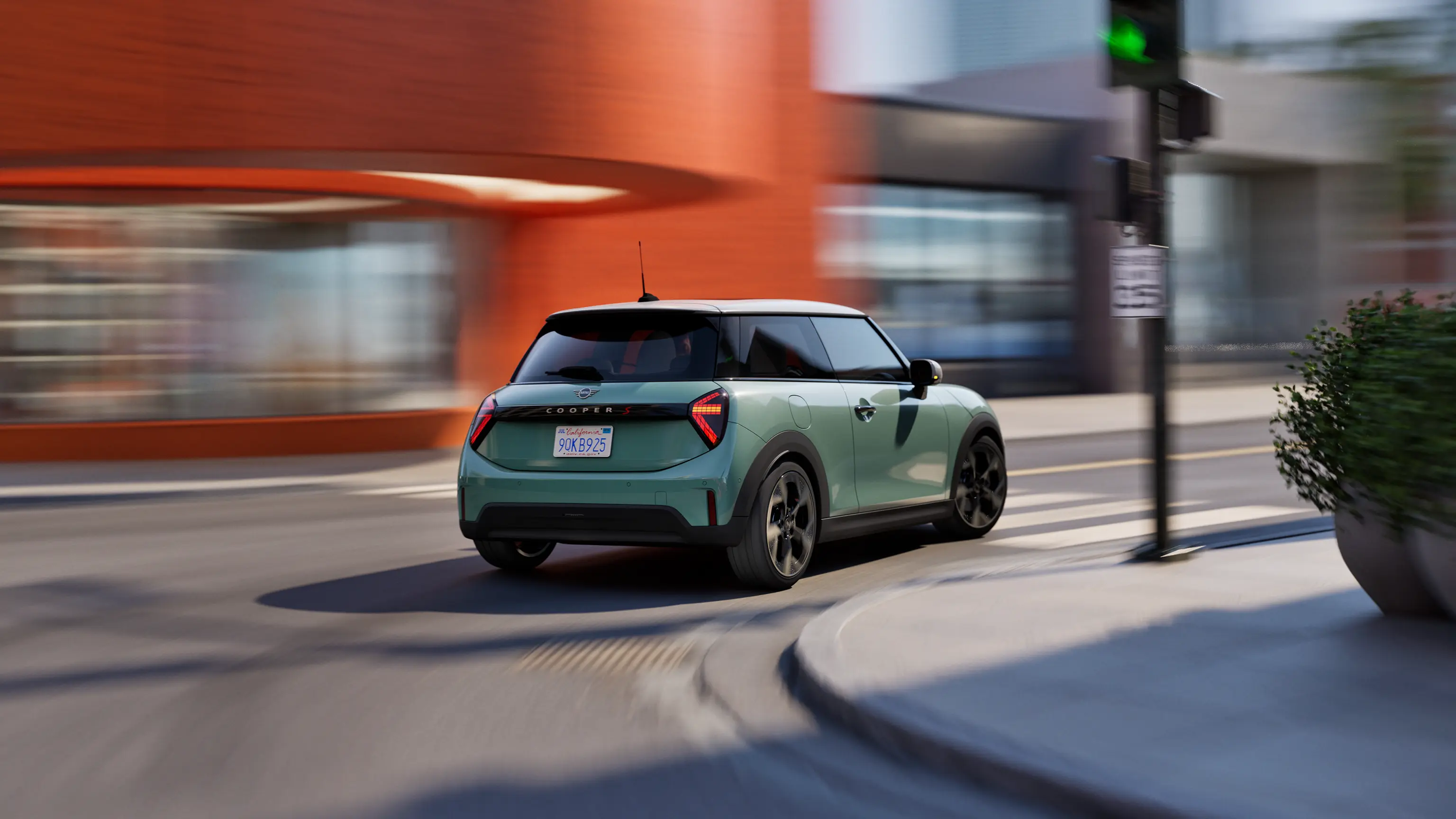 The moving New MINI Cooper visually emerges from a circle on a light blue background.