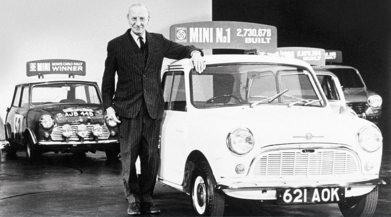 Designer Sir Alec Issigonis at his retirement party in 1971, standing  next to the first ever Morris Mini-Minor. 