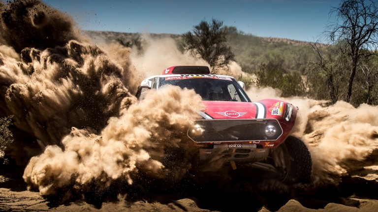 Frontal shot of MINI John Cooper Works Buggy driving through the sand dunes at Dakar Rally 2018.