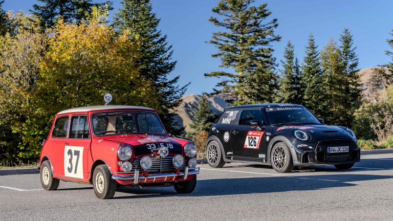 1964 Mini that won the Rally parked next to a contemporary MINI rally car.