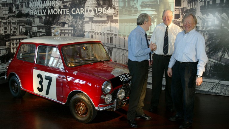 Paddy Hopkirk, Timo Maekinen, and Rauno Aaltonen reunite decades later to celebrate the #37 red Mini that they drove to victory.