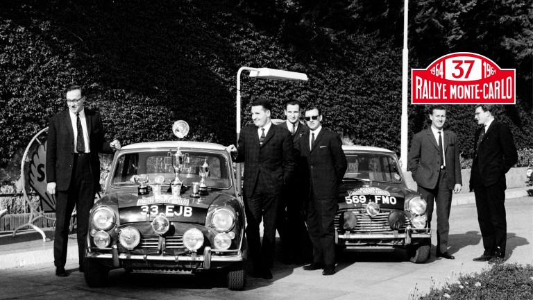 1964 Monte Carlo Rally winners show off their trophies.