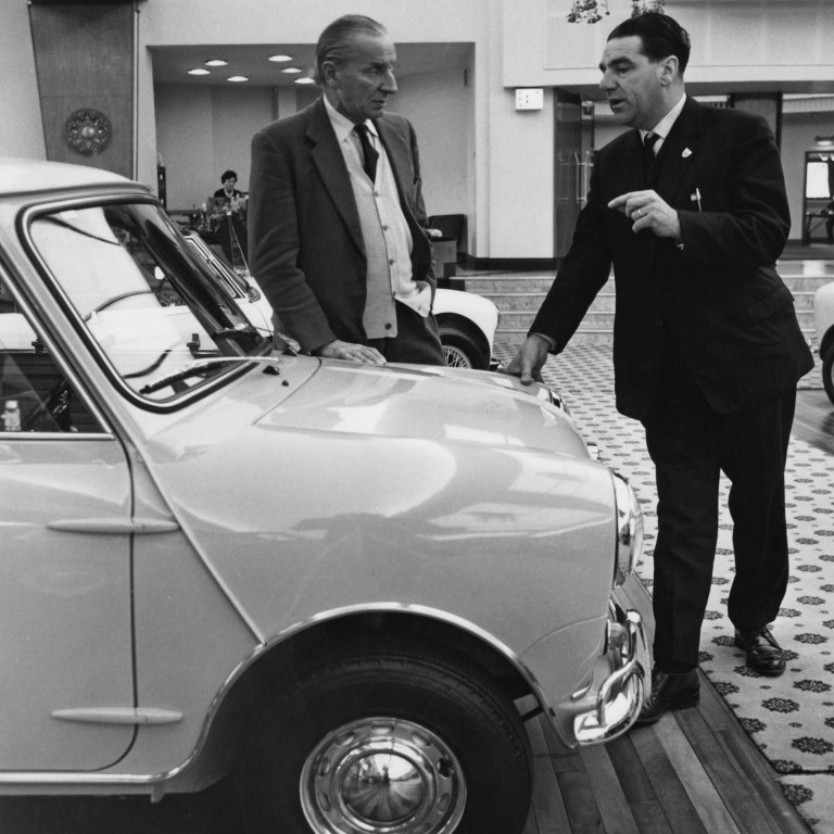 British-Greek car designer Alec Issigonis, Technical Director of BMC, talking to John Cooper about the Mini Cooper at Longbridge, Birmingham, December 1962.