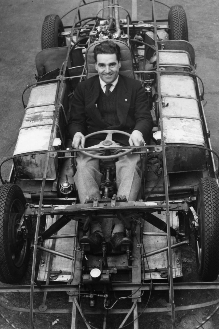 John Cooper, sitting in the 'dish cover' racing car designed by him and his father Charles Cooper.