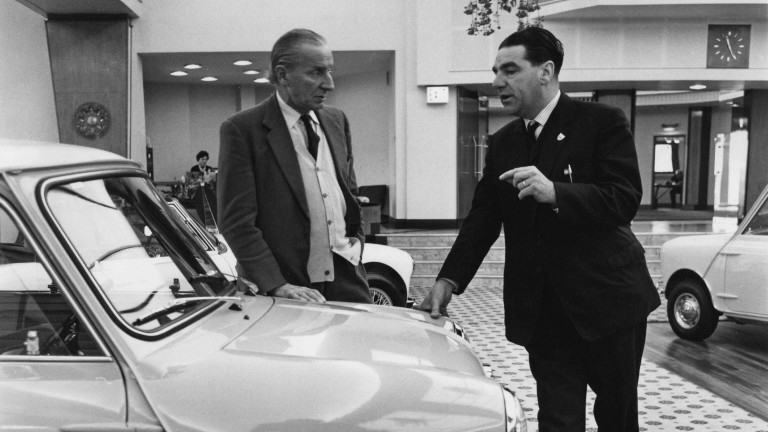 British-Greek car designer Alec Issigonis, Technical Director of BMC, talking to John Cooper about the Mini Cooper at Longbridge, Birmingham, December 1962.