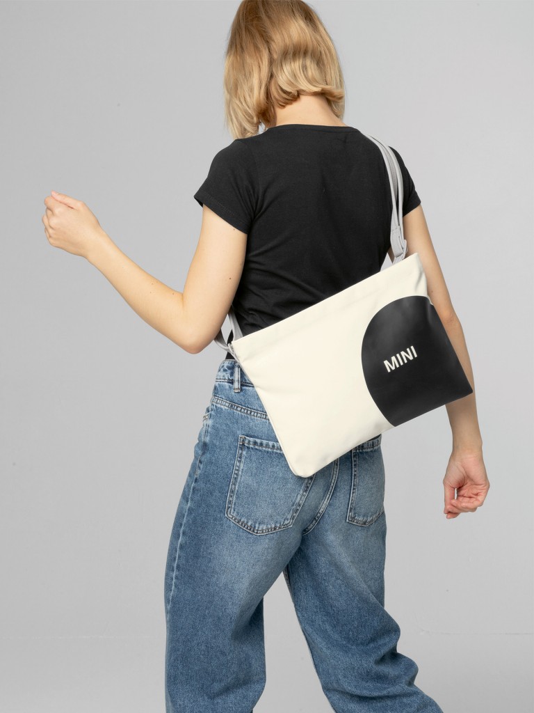 MINI car face detail musette in white and black with grey straps.