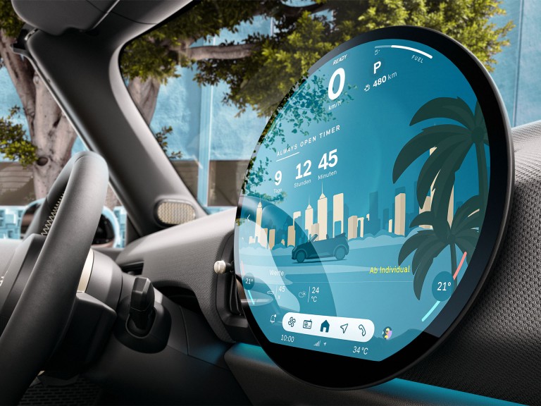 Angled close-up of the round OLED display in the new MINI Cooper Convertible.
