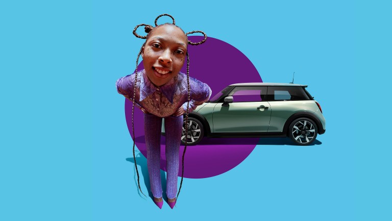The New MINI Cooper stands crosswise on a purple circle in front of a light blue background. A woman dressed in purple covers the front of the car.