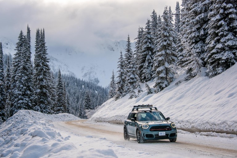 Image of the MINI Countryman, driving through the snowy landscape of British Columbia, Canada. 