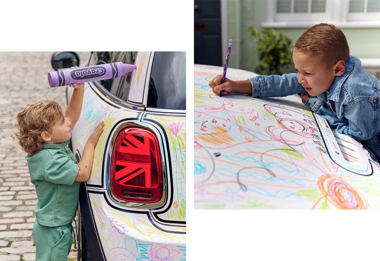 Two staggered images. Left image: Little boy drawing with huge Crayola on the left side of the MINI Cooper. Right image: Boy leaning over the hood of the MINI Cooper, drawing on it with Crayola.