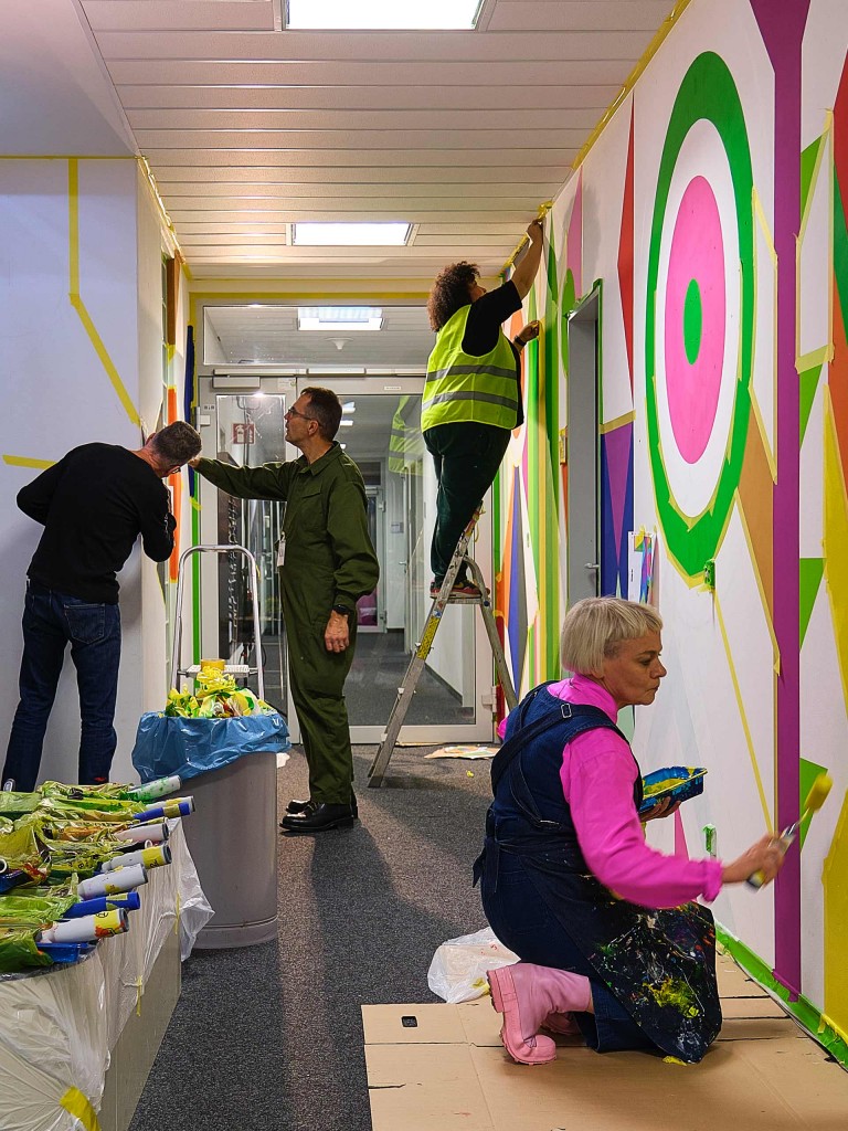 Morag Myerscough and her team working on the hallway of the MINI Headquarter in Munich, Germany.