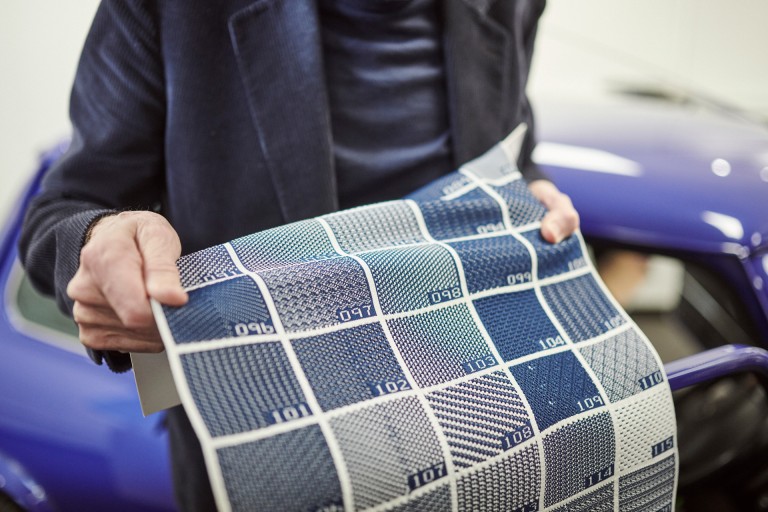 Close-up of Paul Smith in Oxford showing different blue samples from the recycled textiles that replace the old seat covers. 