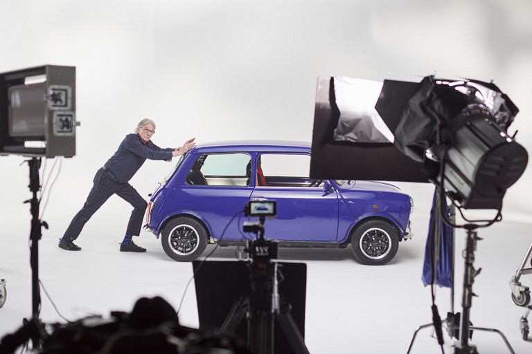 On set: Paul Smith pretends to push the car.