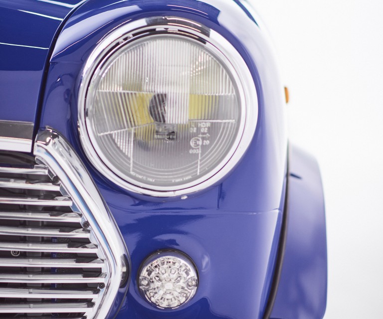 Close-up of a headlight of the MINI Recharged model. 