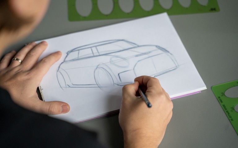 A look over the shoulder: MINI Automotive Designer Josef Kuhlmann drawing a MINI.