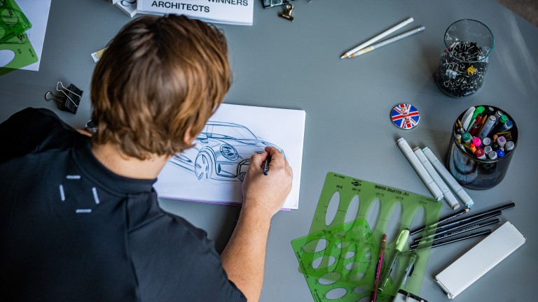 A bird’s eye view: MINI Automotive Designer Josef Kuhlmann drawing a MINI.