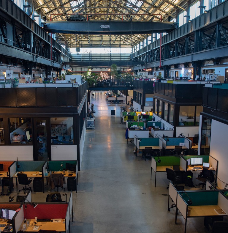Inside shot of the Newlab building in the Brooklyn Navy Yard, with its co-working space and several levels.